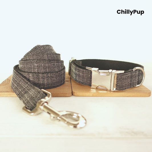 Grey dog collar and lead set with metal clip on a wooden board, branded 'ChillyPup'.