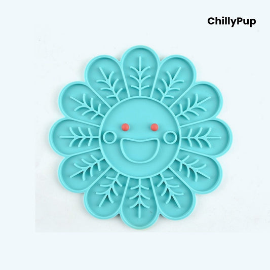 Blue pet lick mat with a smiling face design on a white background, branded 'ChillyPup'.