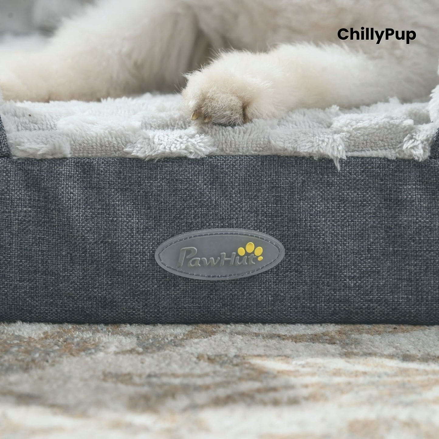 Dog lying on a grey pet bed with 'PawHut' branding, featuring the brand name 'ChillyPup'.