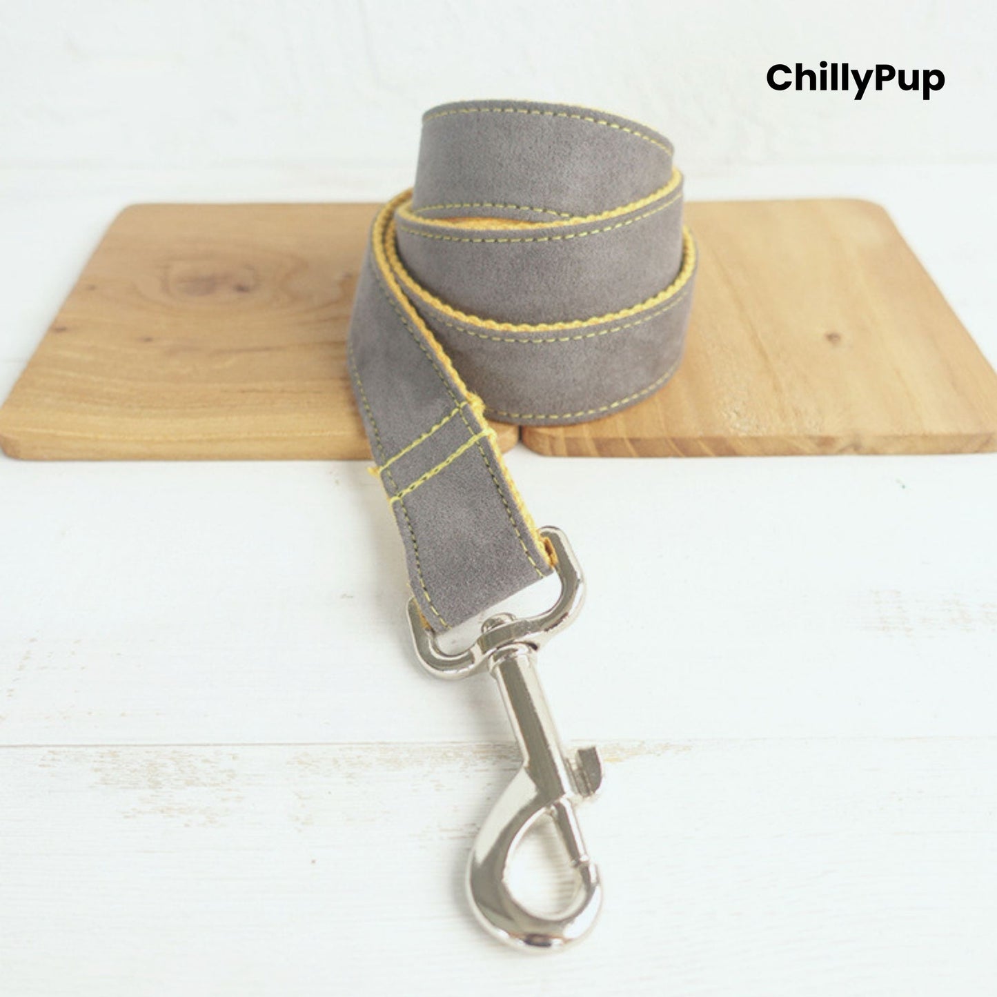 Grey and yellow dog leadwith a clip on a white background, branded 'ChillyPup'.