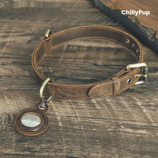 Brown leather dog collar with brass hardware on a wooden surface, branded 'ChillyPup'.
