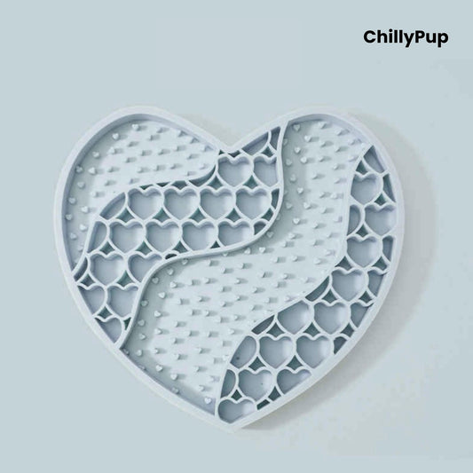 Heart-shaped purple dog lick mat with textured surface on a light gray background, branded 'ChillyPup'.
