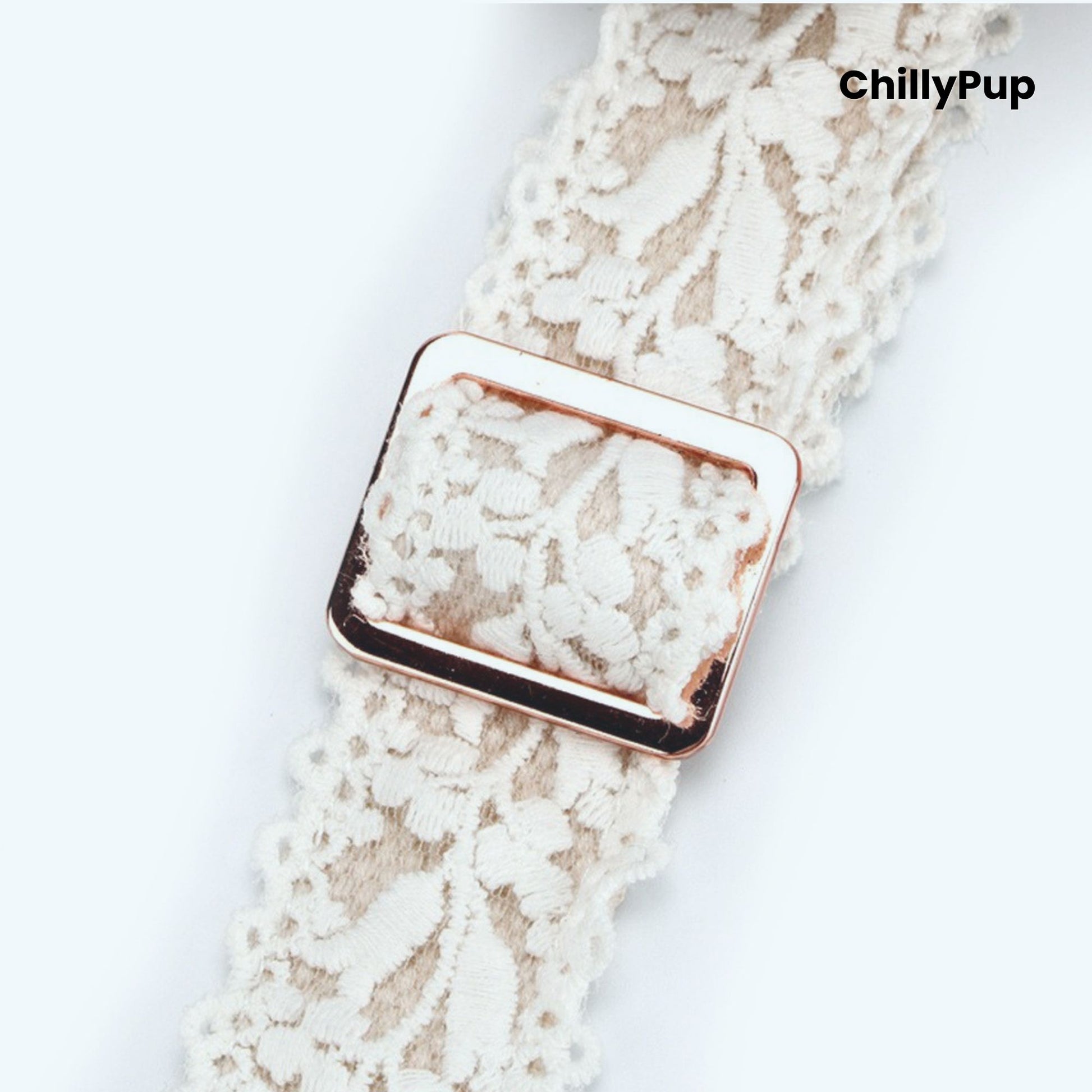 White lace dog Collar with a rose gold clasp on a white background, branded 'ChillyPup'.