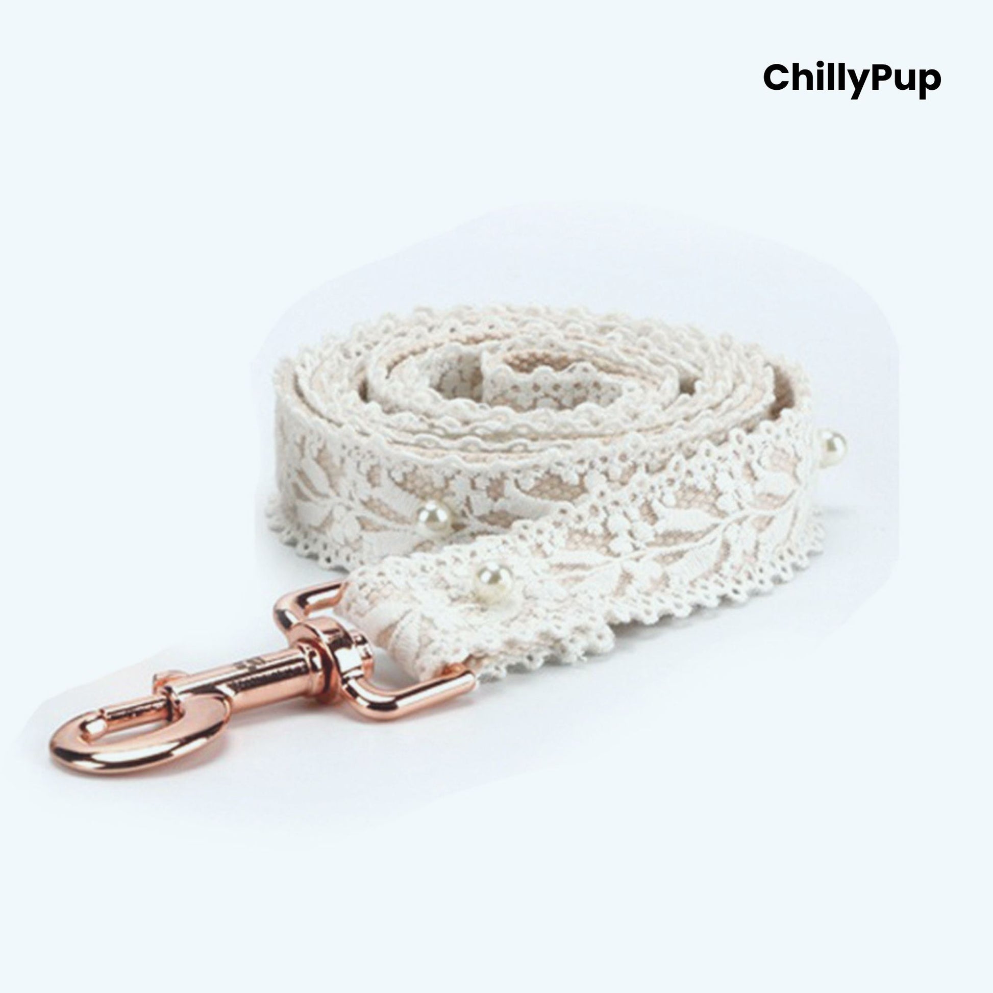 White lace dog lead with a rose gold clasp on a white background, branded 'ChillyPup'.