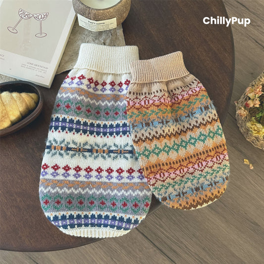 Knitted dog jumper with colourful pattern on a white surface, brand 'ChillyPup' visible.