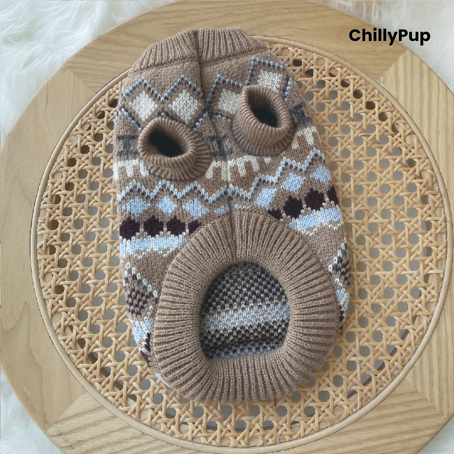 Patterned dog sweater on a wooden surface with 'ChillyPup' branding.