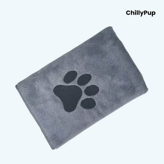 Grey towel with black paw print design on a white background, branded 'ChillyPup'.