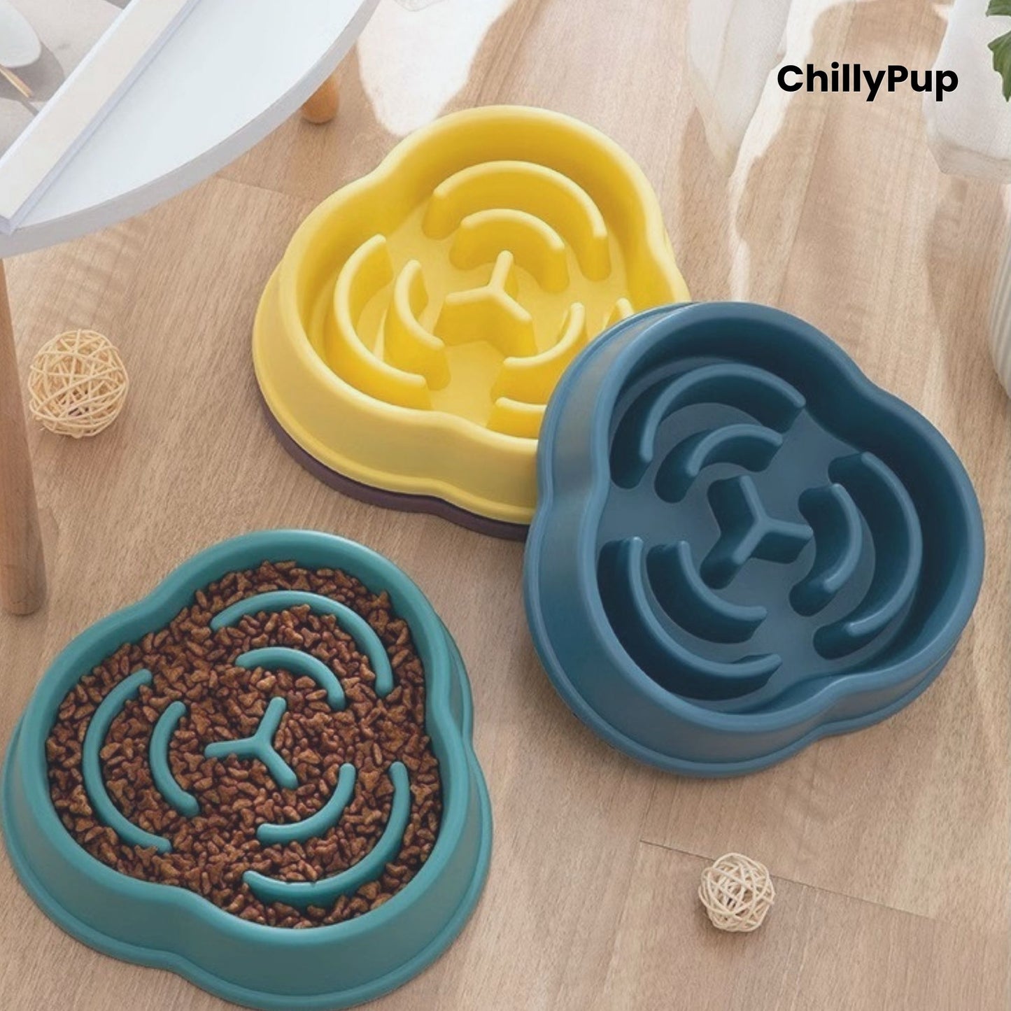 Three pet bowls with maze design on a wooden surface, branded 'ChillyPup'.