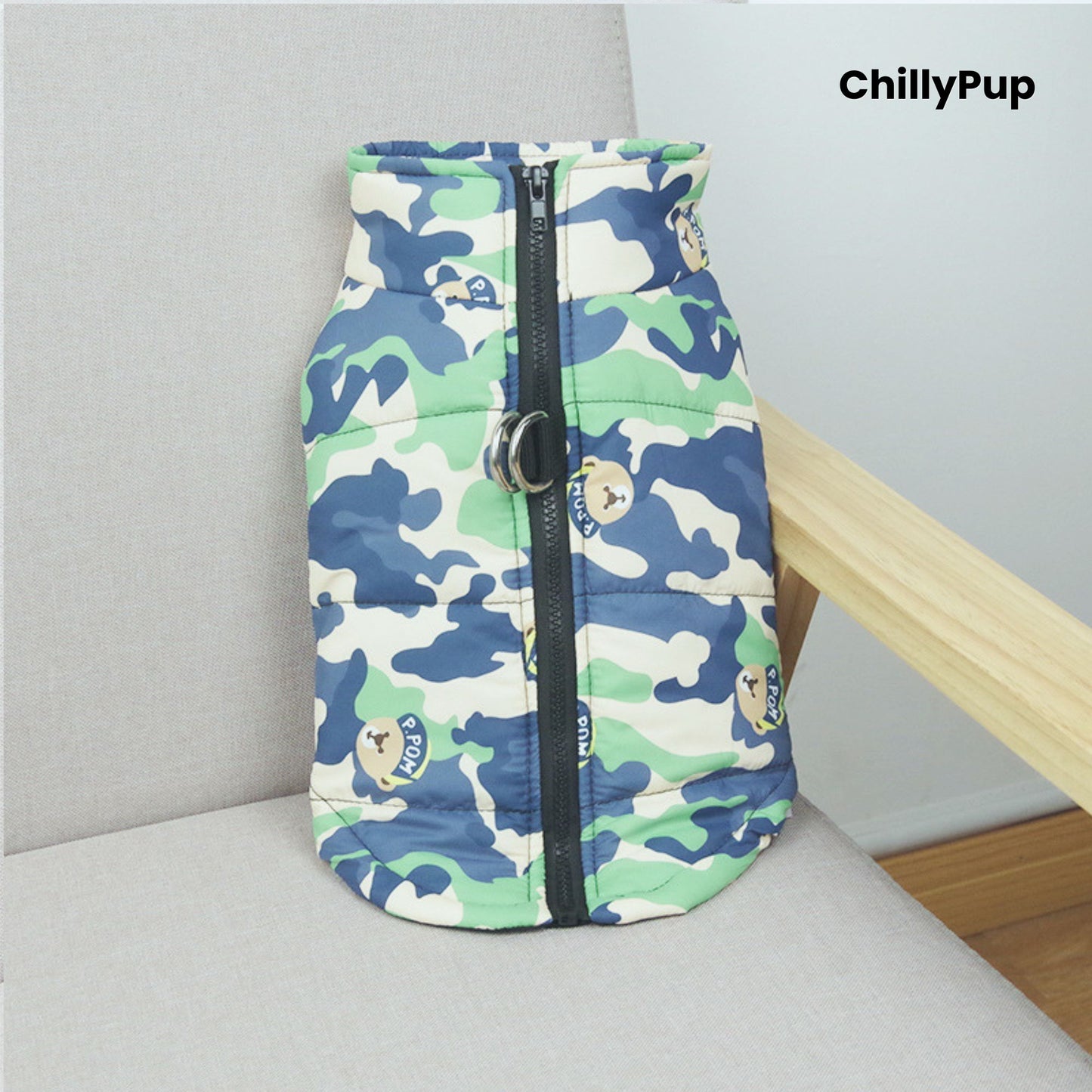 Camo dog coat with a visible Chillypup name on a light grey surface.