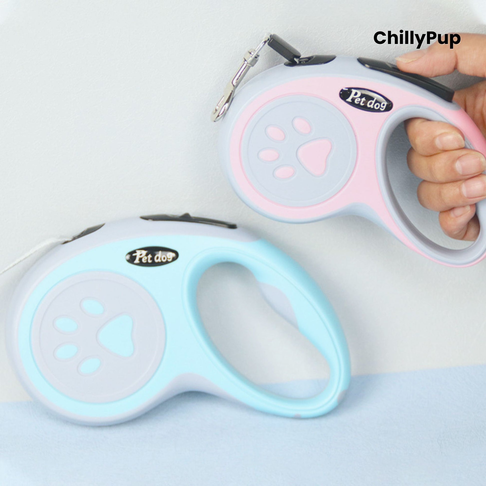 Retractable dog Leads with pink and grey design featuring a paw print, branded 'ChillyPup'.