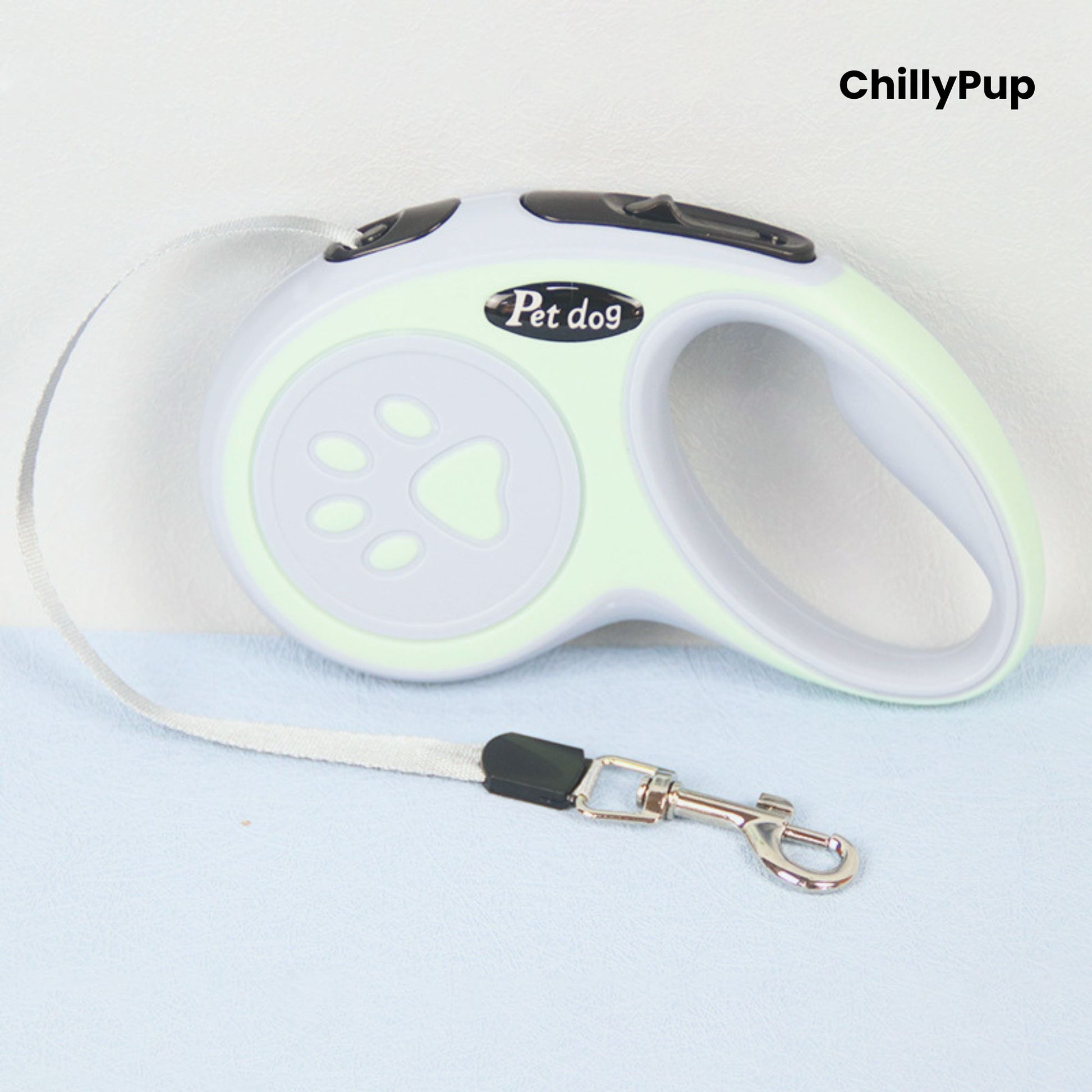 Retractable dog Lead with green and grey design featuring a paw print, branded 'ChillyPup'.