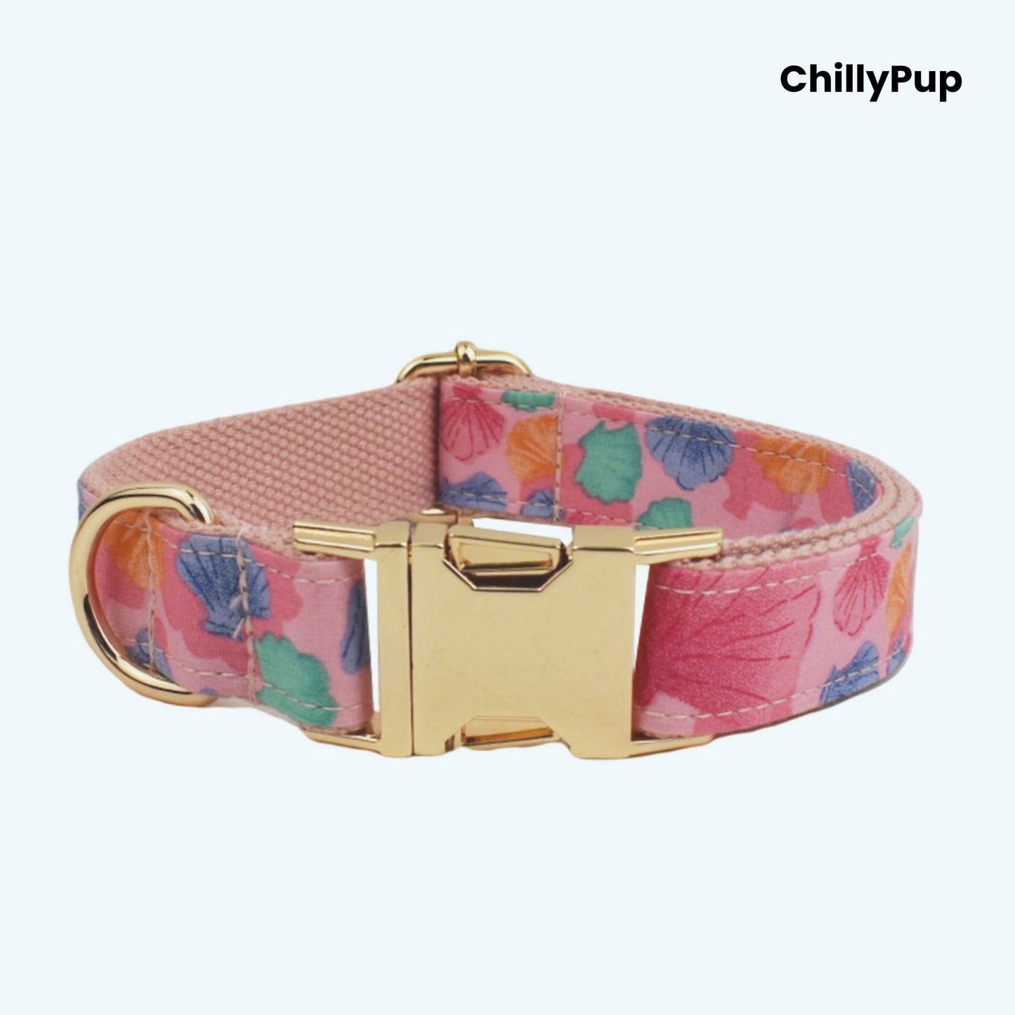 Seashell dog collar and lead set with gold hardware on a white background, branded 'ChillyPup'.