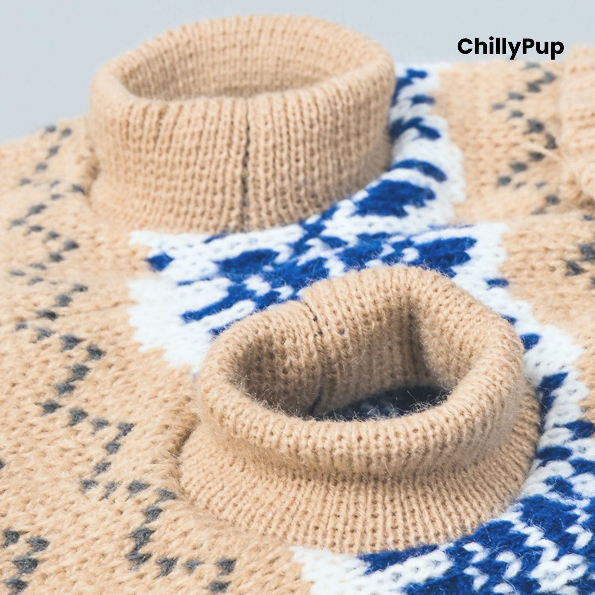 Close-up of beige knitted dog sweaters with a patterned background, featuring the brand 'ChillyPup'.