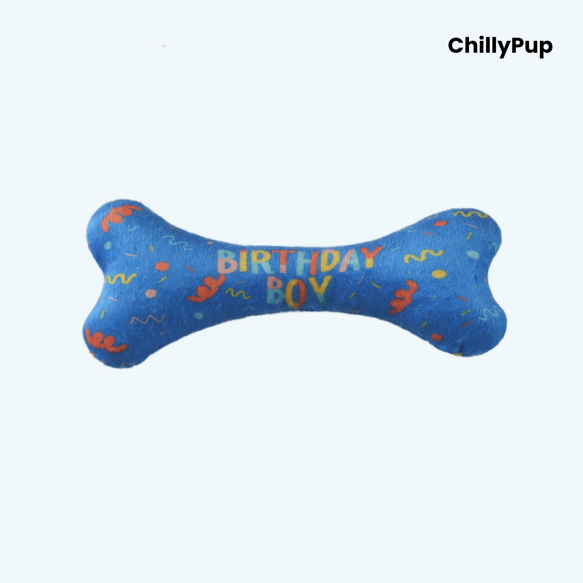Blue bone-shaped toy with 'Birthday Girl' text and colorful patterns on a white background, branded 'ChillyPup'.