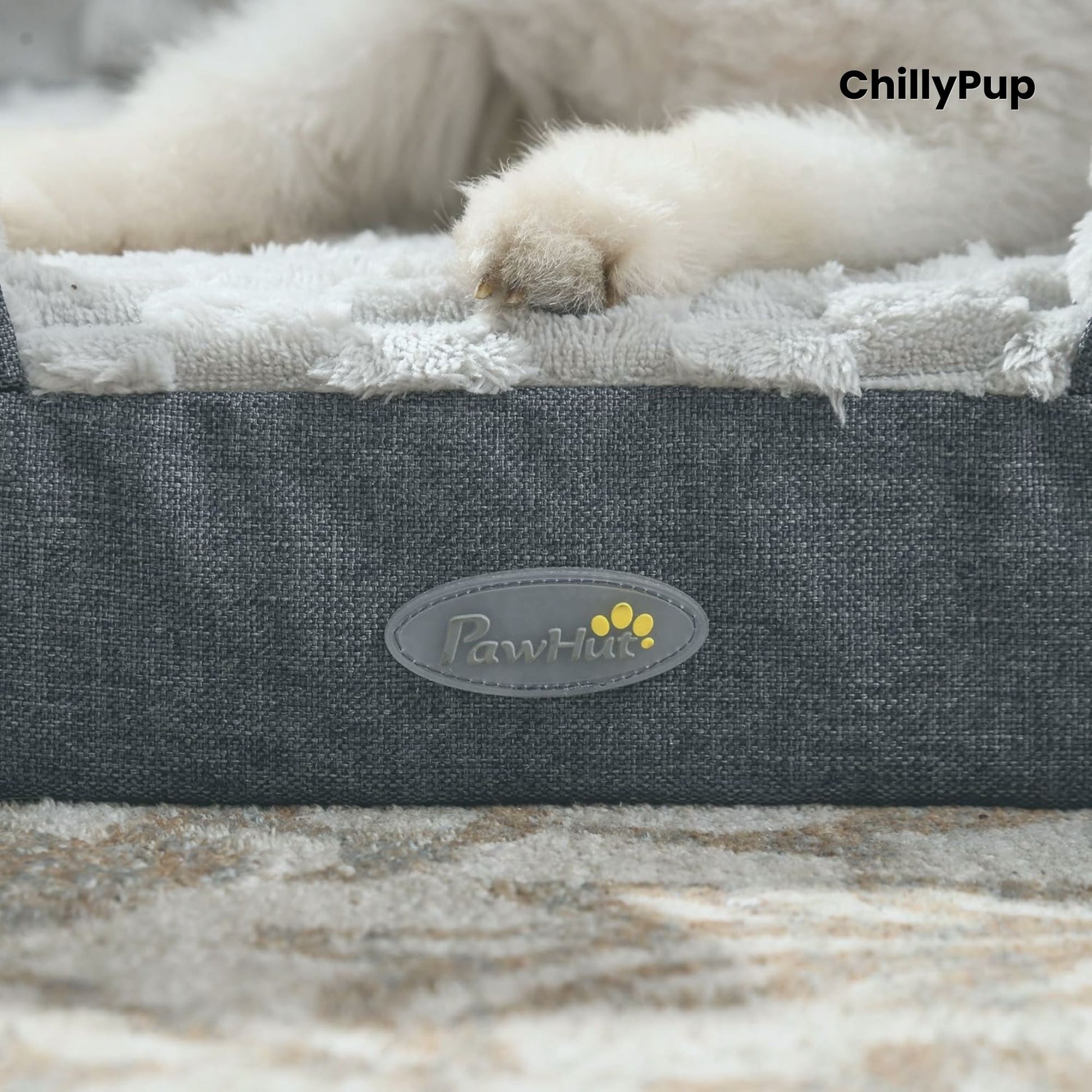 Dog lying on a grey pet bed with 'PawHut' branding, featuring the brand name 'ChillyPup'.