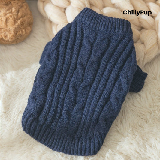 Folded navy Blue cable knit sweater on a white surface with 'ChillyPup' branding.