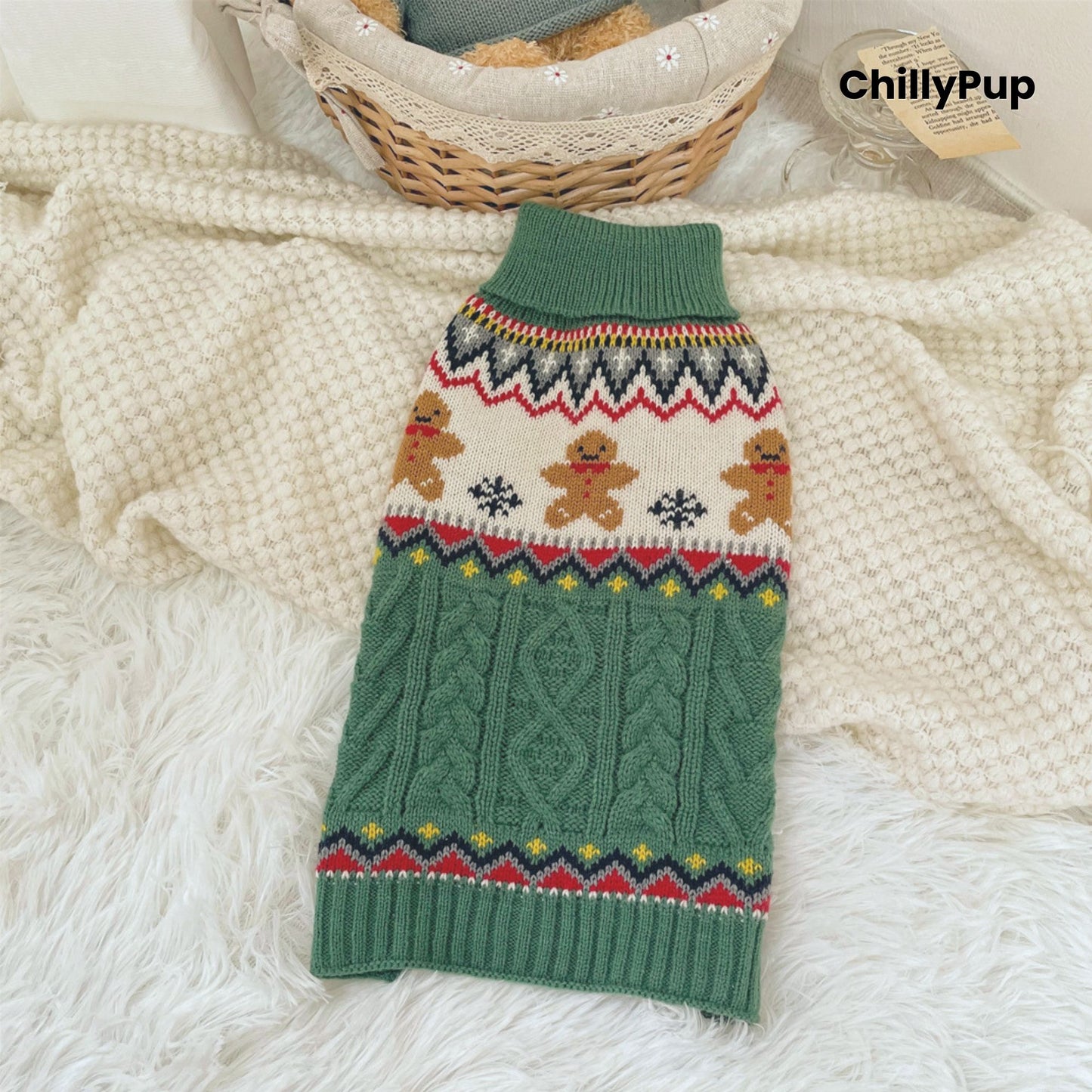 Green dog sweater with festive pattern on a fluffy white surface, branded 'ChillyPup'.