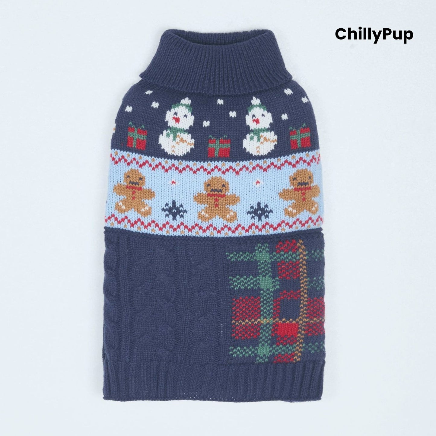 Knitted dog sweater with Christmas design on a wooden surface, surrounded by festive decor. branded with ChillyPup.