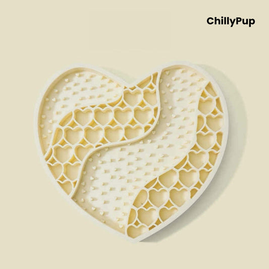 Heart-shaped purple dog lick mat with textured surface on a light gray background, branded 'ChillyPup'.