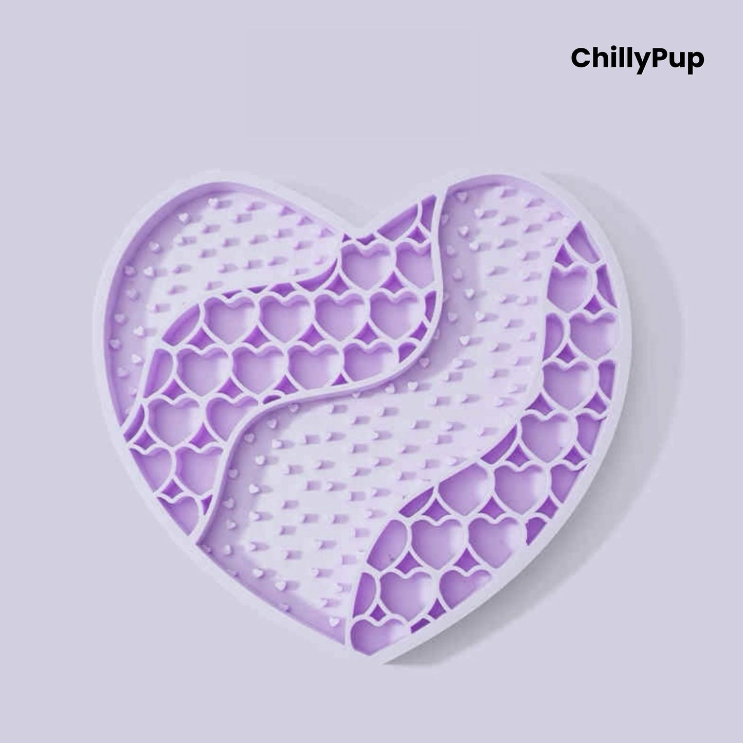 Heart-shaped purple dog lick mat with textured surface on a light gray background, branded 'ChillyPup'.