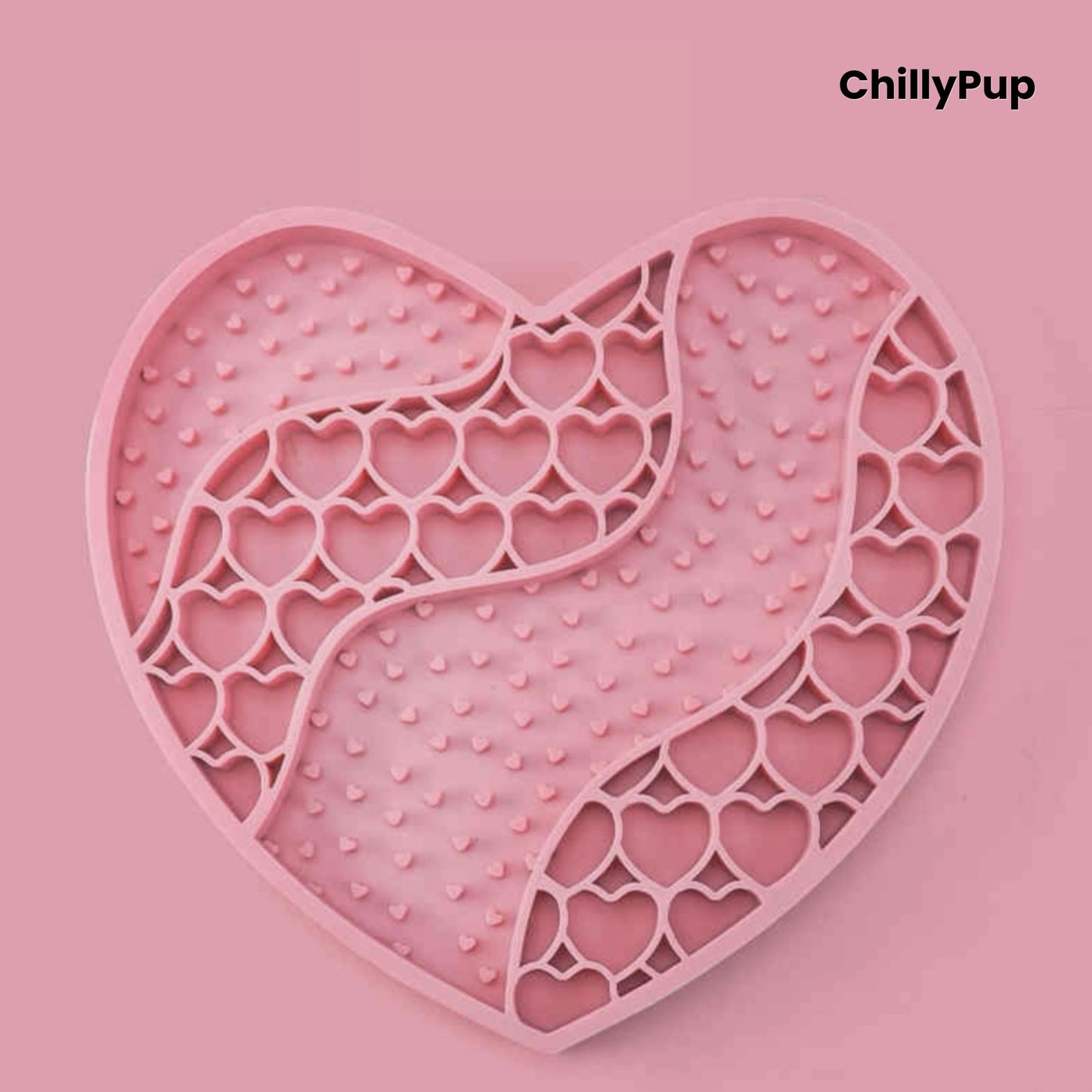 Heart-shaped purple dog lick mat with textured surface on a light gray background, branded 'ChillyPup'.
