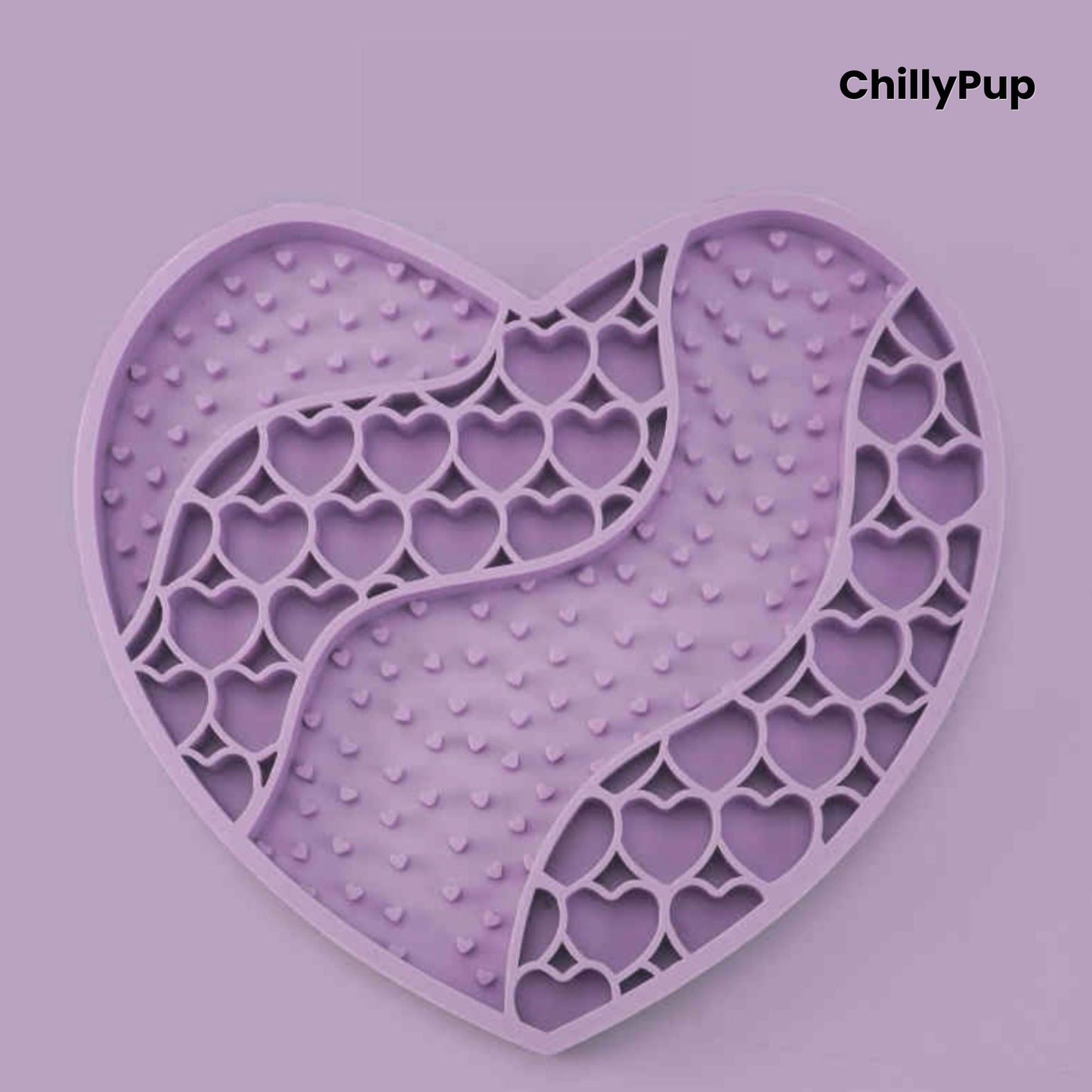Heart-shaped purple dog lick mat with textured surface on a light gray background, branded 'ChillyPup'.
