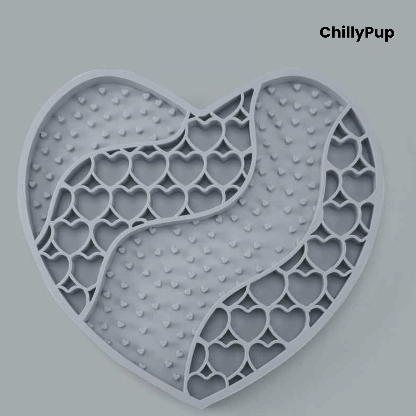Heart-shaped purple dog lick mat with textured surface on a light gray background, branded 'ChillyPup'.