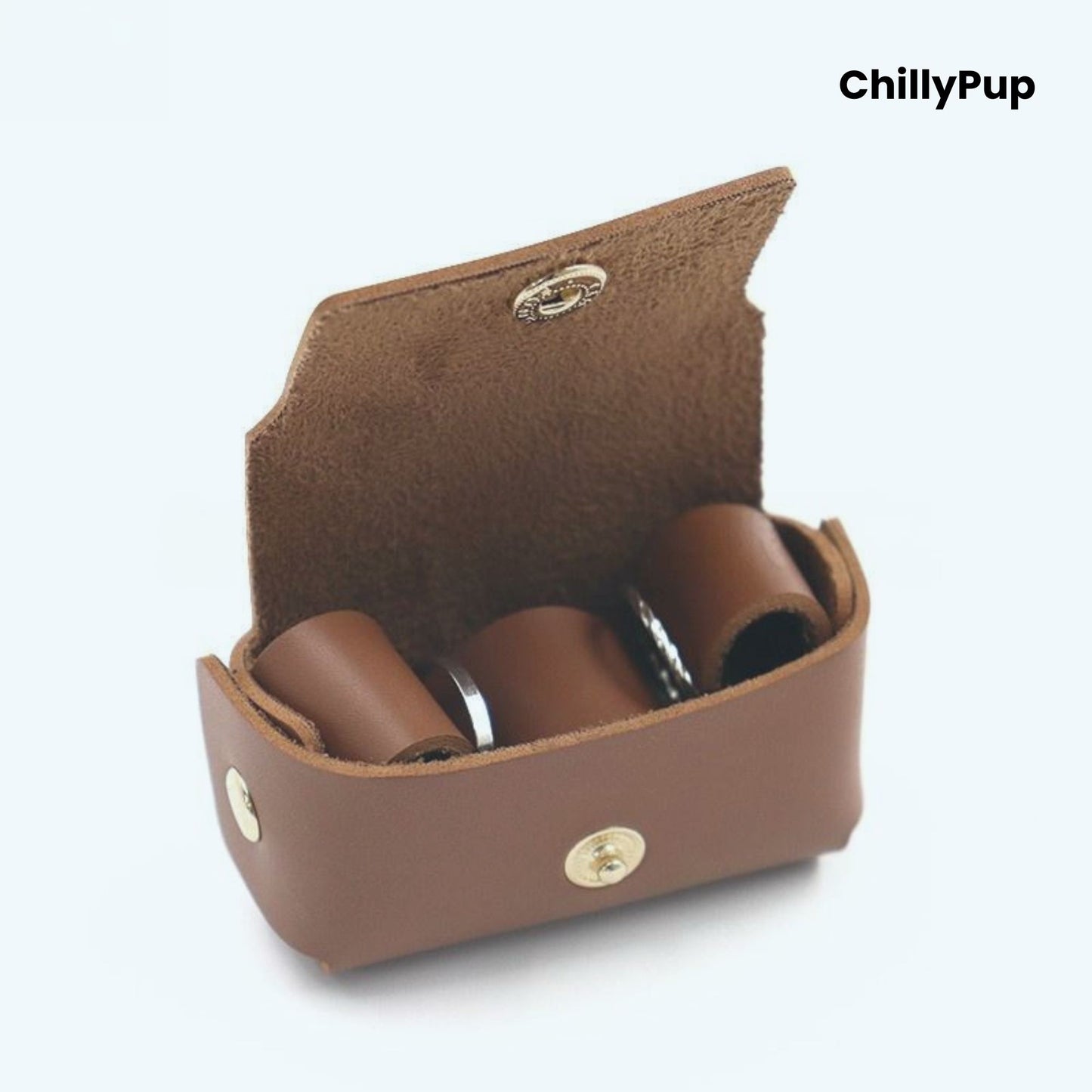 Brown leather ring case with three cylindrical items inside, branded 'ChillyPup'.