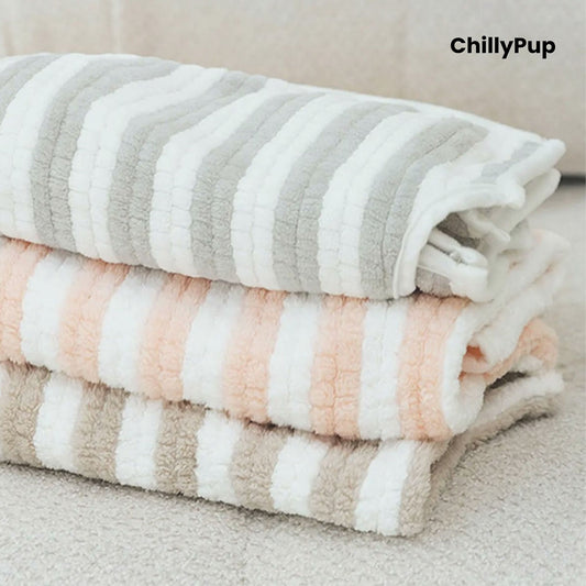 Stack of folded striped dog robes with 'ChillyPup' branding on a neutral background