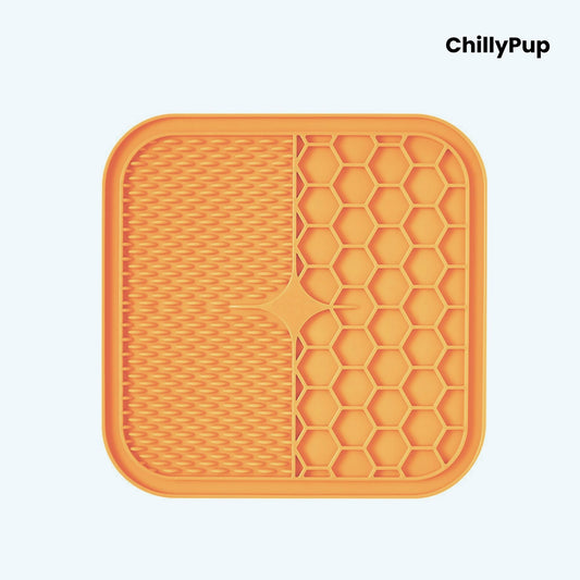 Orange silicone mat with textured surface and honeycomb pattern on a white background, branded 'ChillyPup'.