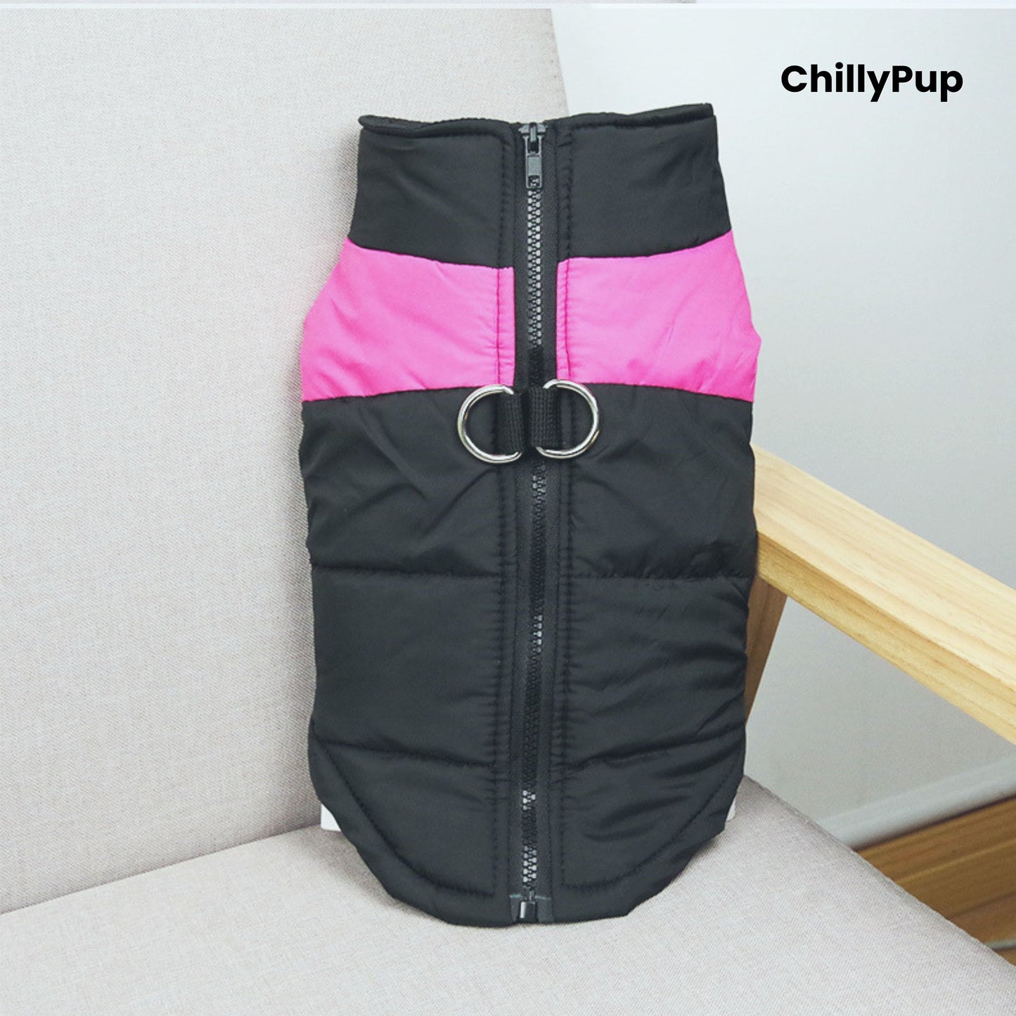 Black and Pink dog coat with a visible Chillypup name on a light grey surface.
