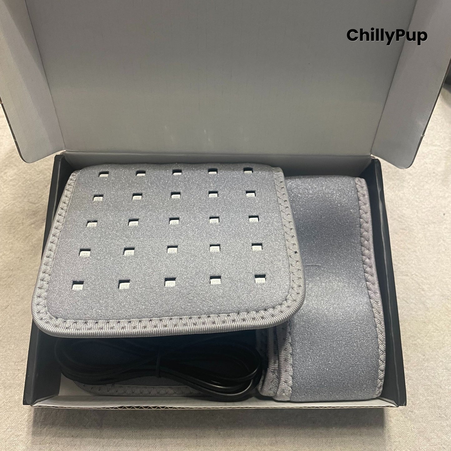 Redlight therapy pad in the box branded with ChillyPup