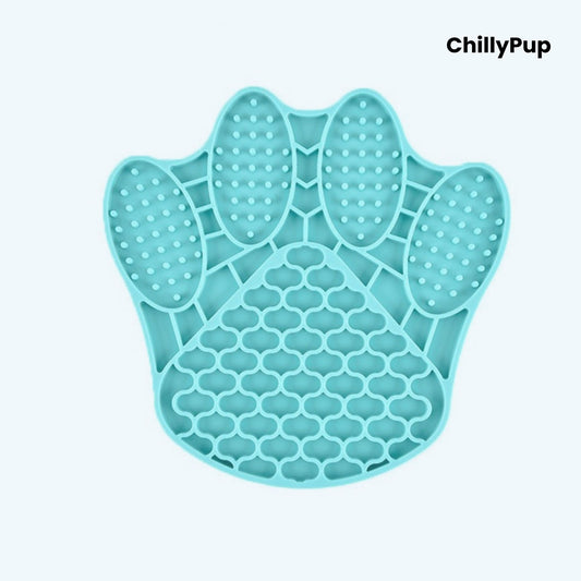 Teal paw-shaped silicone mat with textured surface on a light blue background, branded 'ChillyPup'.