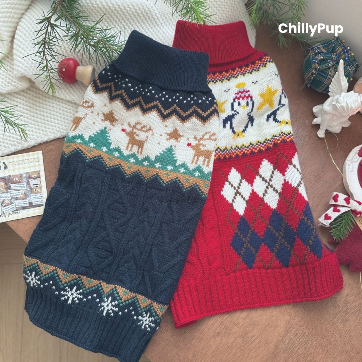 Two dog jumpers with festive patterns on a wooden surface, branded 'ChillyPup'.