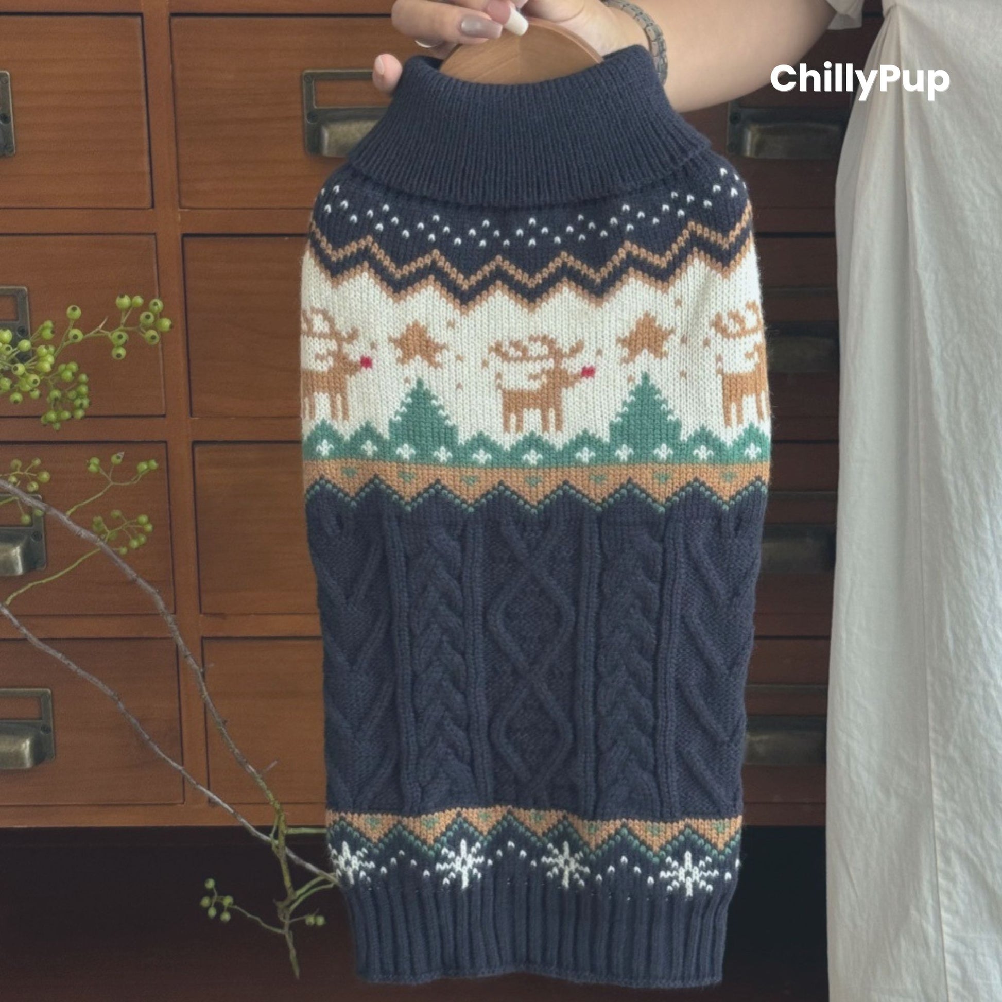 dog jumper with festive patterns on a wooden surface, branded 'ChillyPup'.