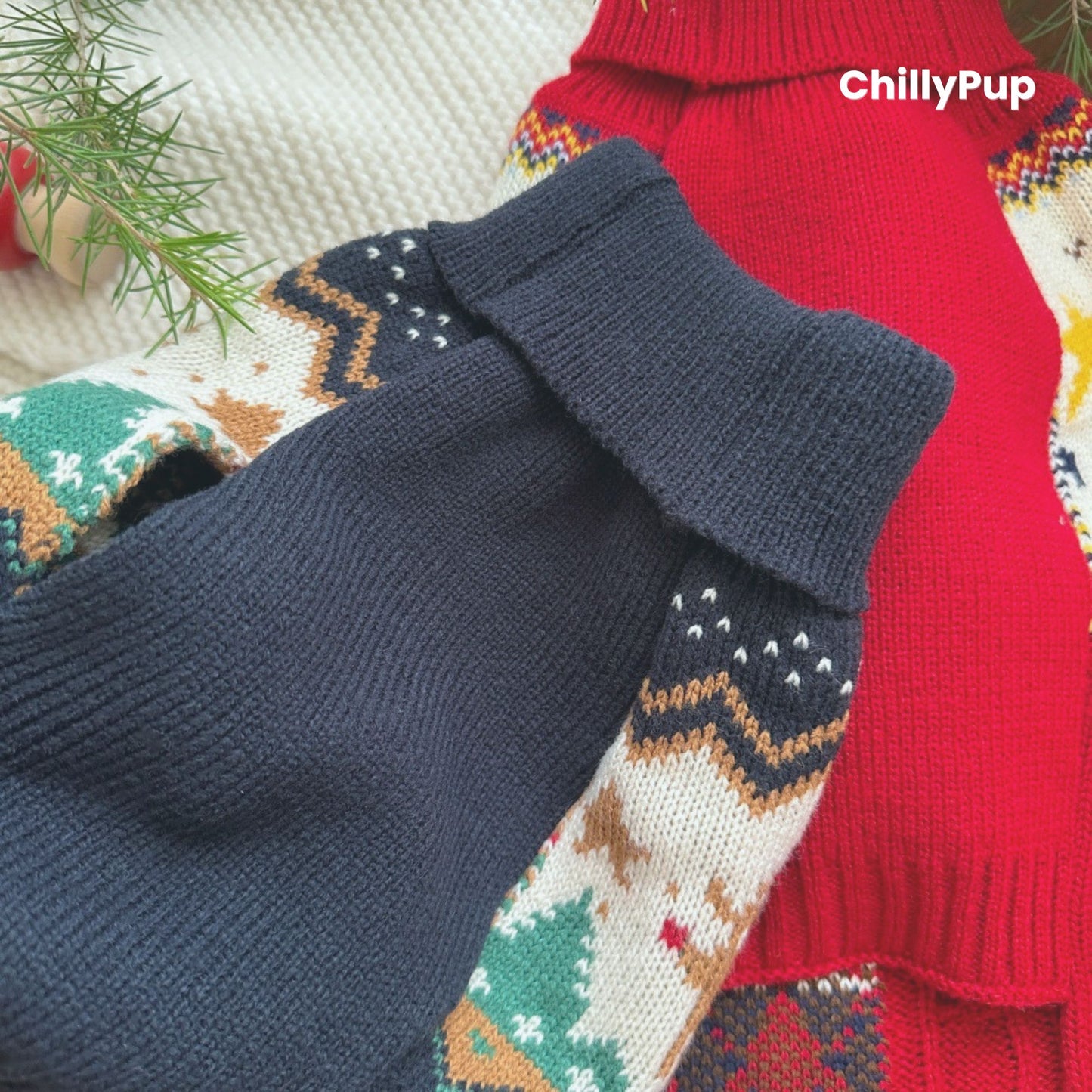 Two dog jumpers with festive patterns on a wooden surface, branded 'ChillyPup'.
